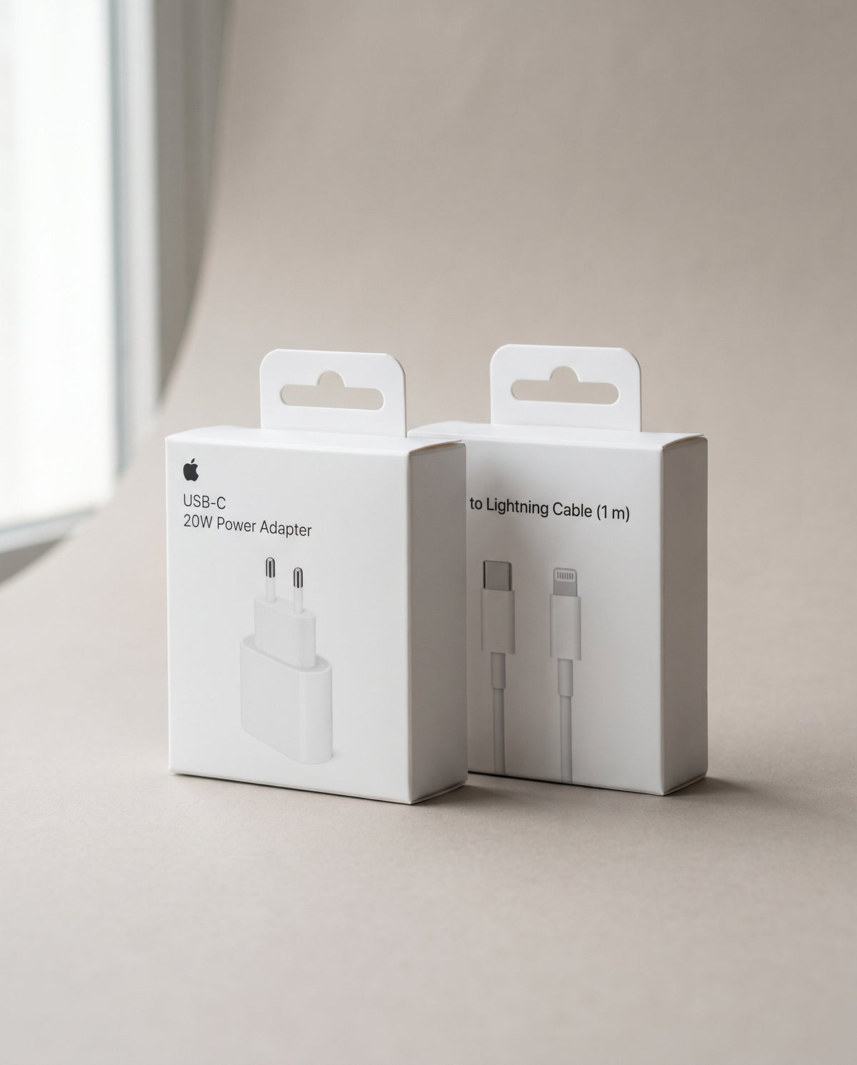 Cajas del adaptador de 20 W y del cable USB-C a Lightning de Apple